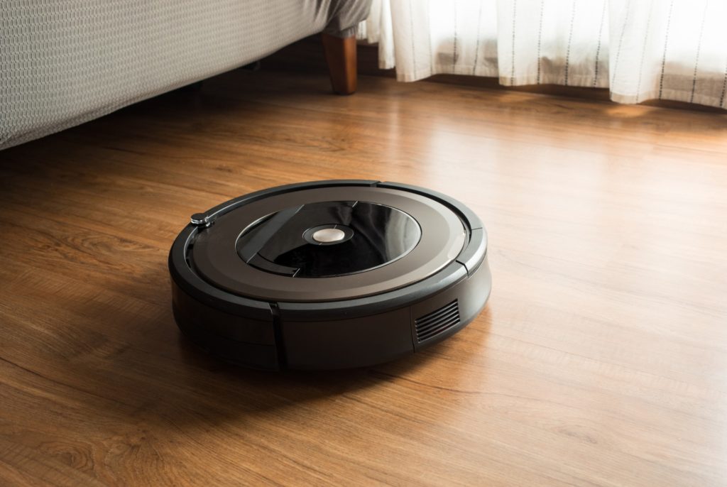 iRobot Roomba cleaning a wood floor